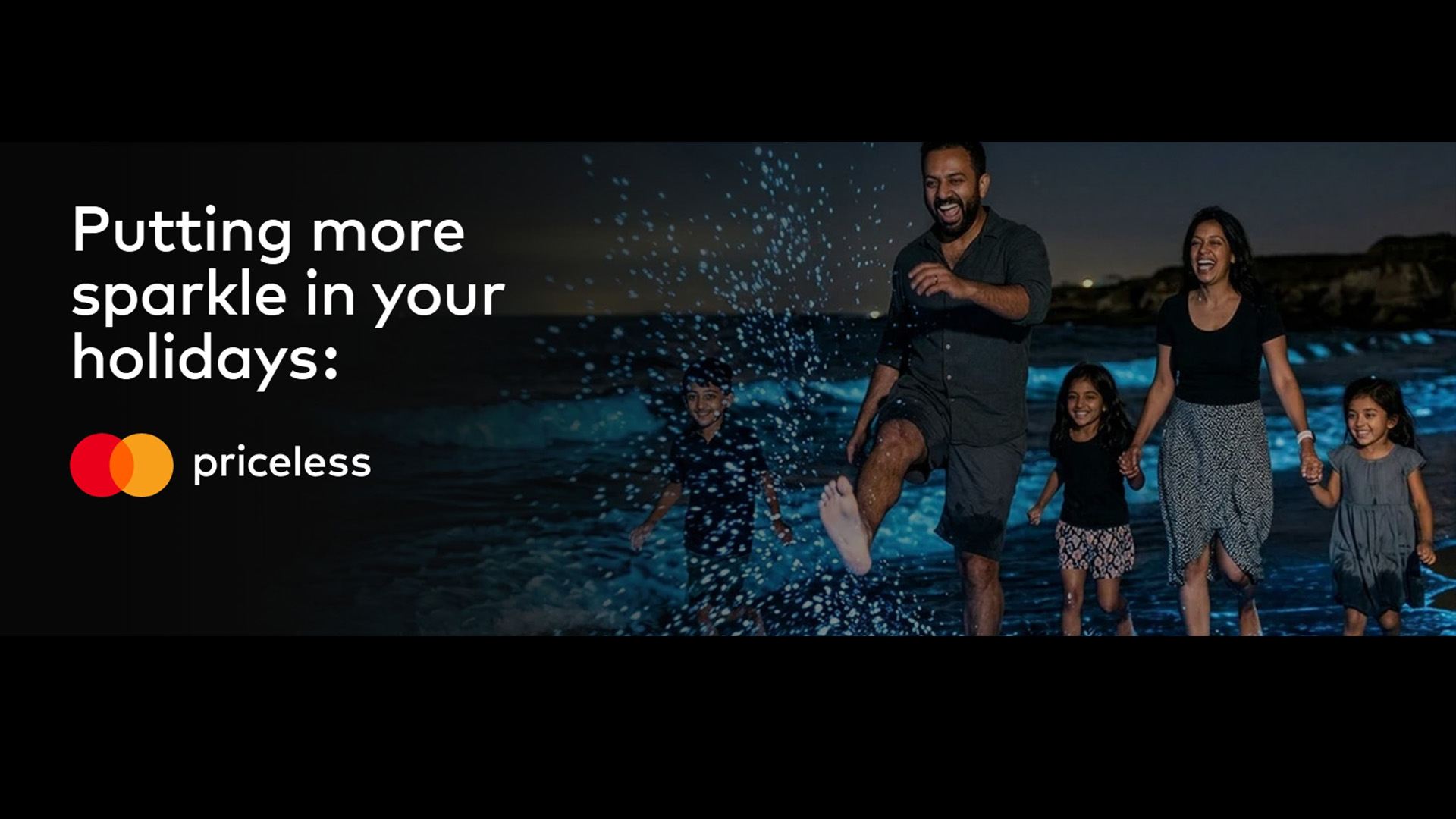 family splashing on the beach - test: master card Pricesless
